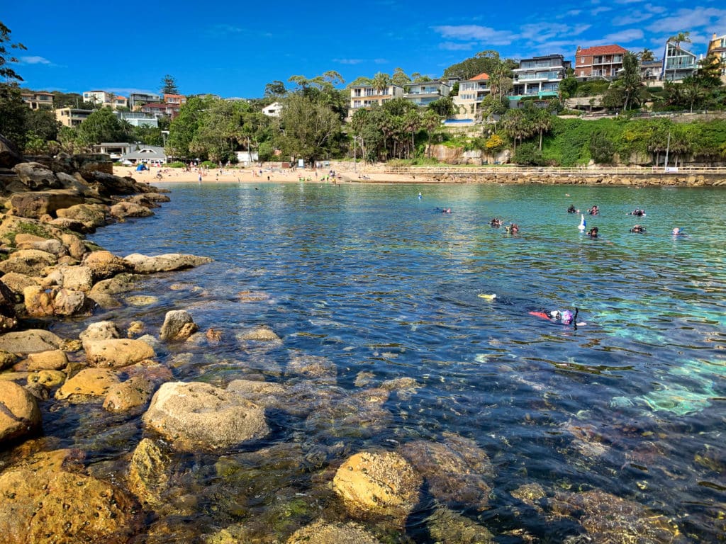 Shelly Beach and coastal walk at Manly viewed on a Sydney 8 Hour Private Tour, showing clear water, headland views, and The Boathouse restaurant.